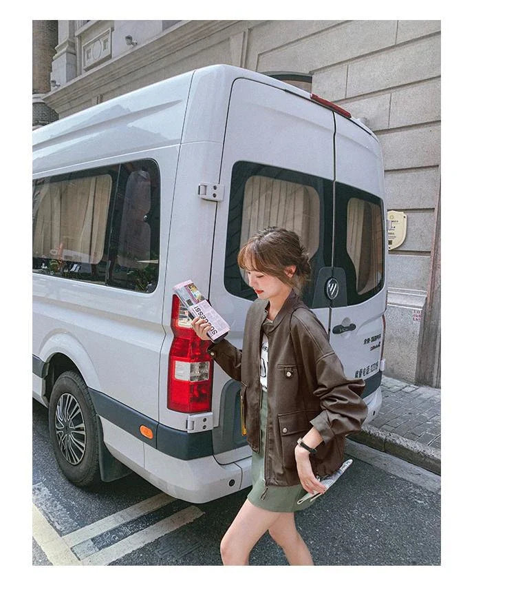 Stylish retro British autumn coat made with premium imitation leather, featuring a stand-up collar and zip-up front closure for a classic and durable look.