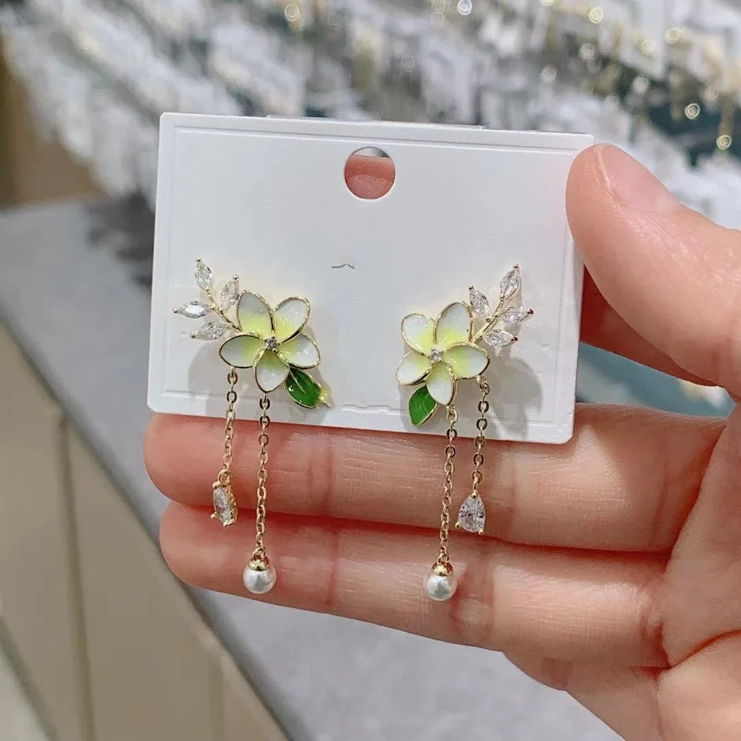 Elegant zircon flower long pearl tassel earrings in silver and gold tones, showcasing a captivating floral design and luxurious cascading tassels