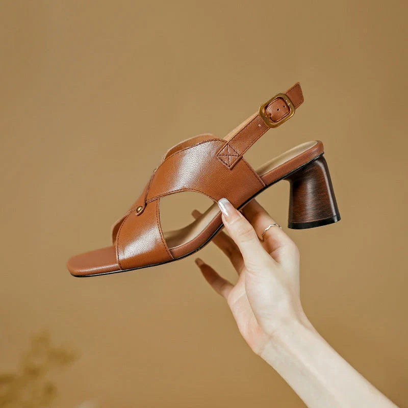 Elegant leather high heel sandals for women, featuring a refined square heel, stylish buckle strap, and sleek design for a sophisticated look.