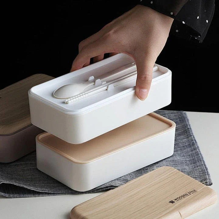 Premium BPA-free double-layer lunch box with stainless steel spoon and chopsticks, perfect for office, picnics, and on-the-go dining