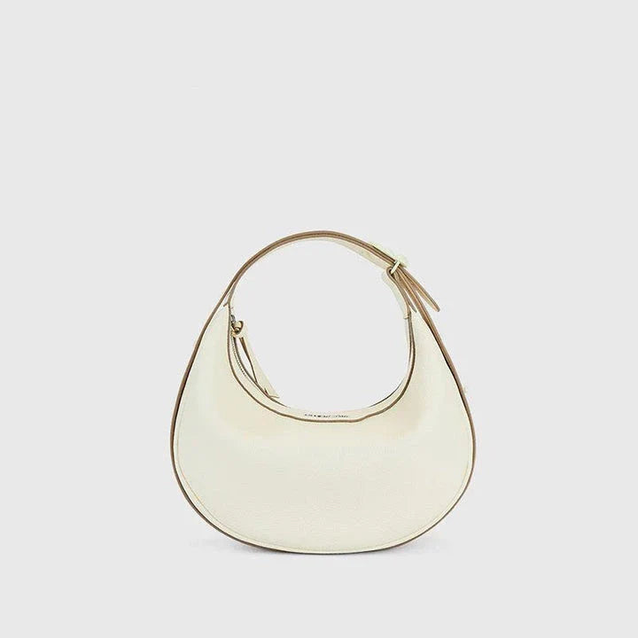 Stylish crescent-shaped leather crossbody bag with soft, supple texture for everyday elegance