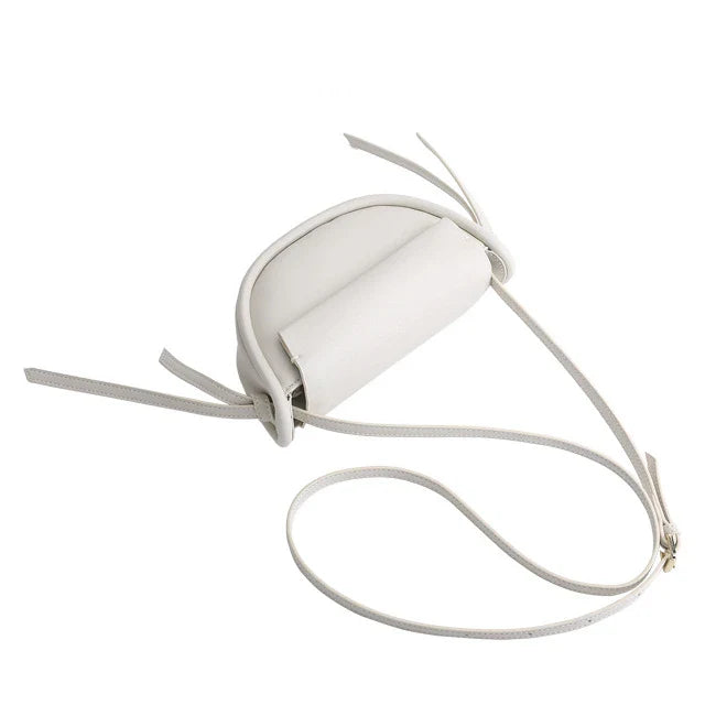 Premium cowhide leather crossbody bag in a distinctive semicircle shape, available in classic colours to complement any UK wardrobe