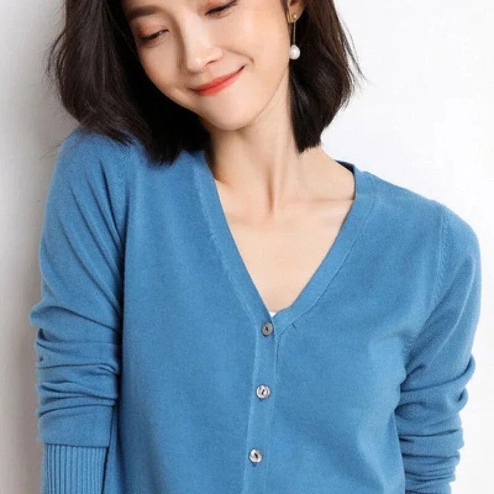Chic v-neck single breasted cardigan in blue, green, and pink colours with a sophisticated and timeless design