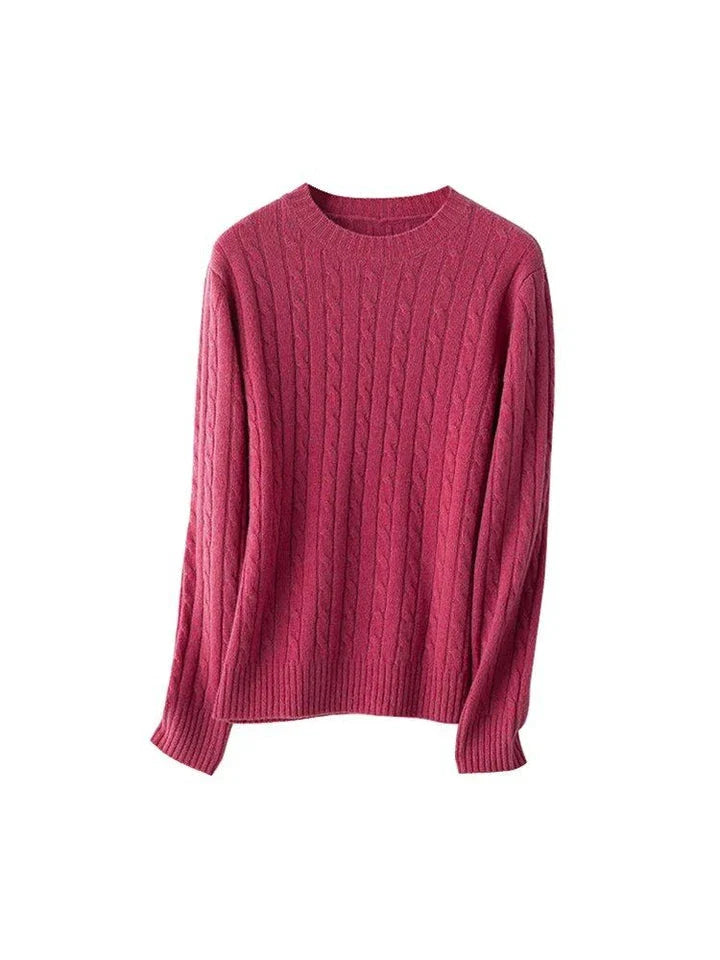A luxurious 100% British wool cable knit jumper in a rich camel colour, perfect for keeping warm during the UK's chilly winters.