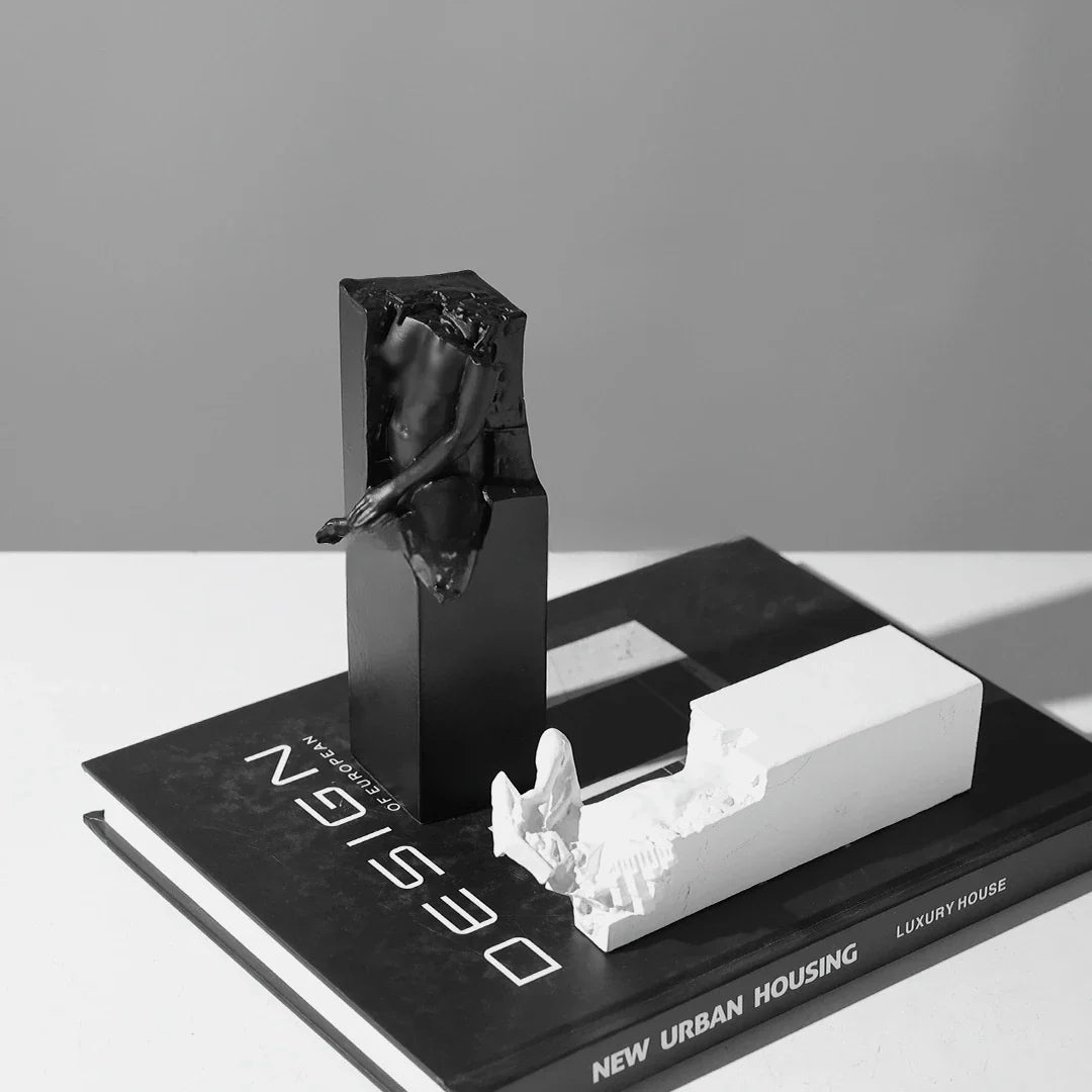 Elegant abstract sculpture in black and white, a minimalist desktop ornament that adds modern art decor to any space