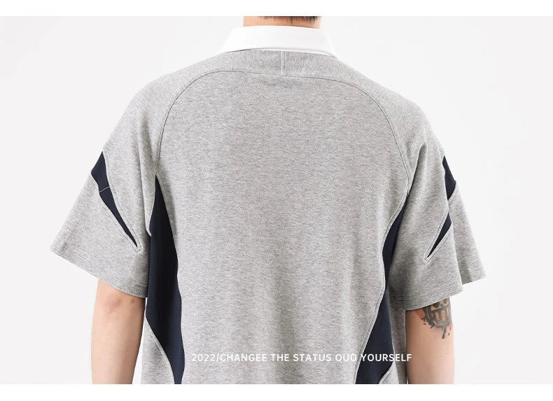 Melange grey polo shirt with contrast stitching, designed and made in Britain for comfortable summer wear