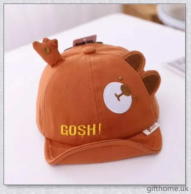 Adorable cartoon baby cap in various colours, made of breathable linen-blend fabric for comfort and sun protection