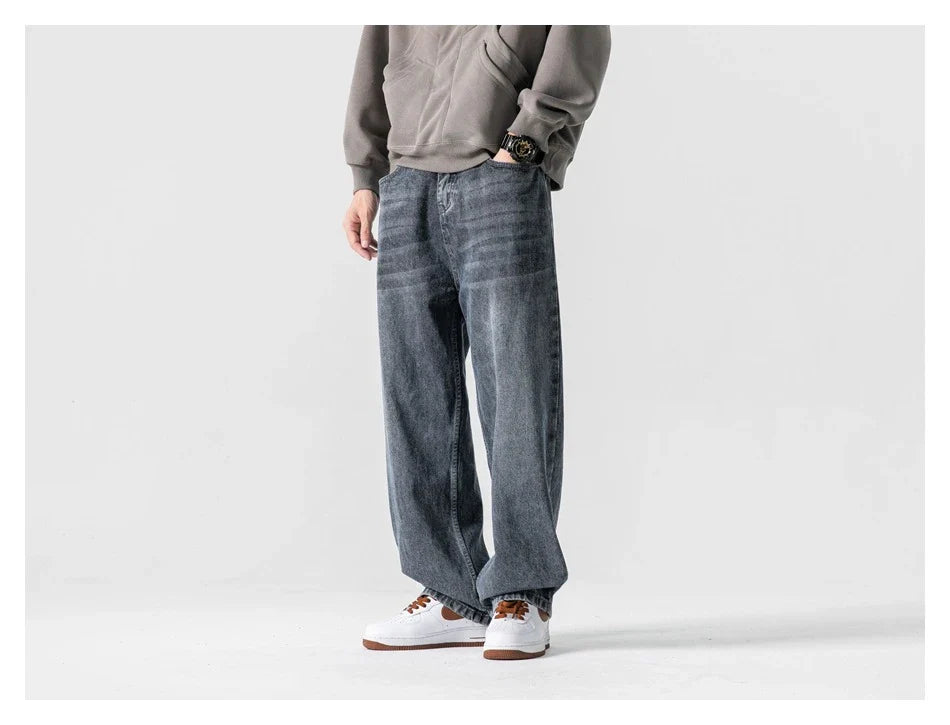 A pair of stylish retro-inspired Japanese jeans in black and grey, featuring a mid-rise waist and straight leg silhouette for a flattering, comfortable fit.