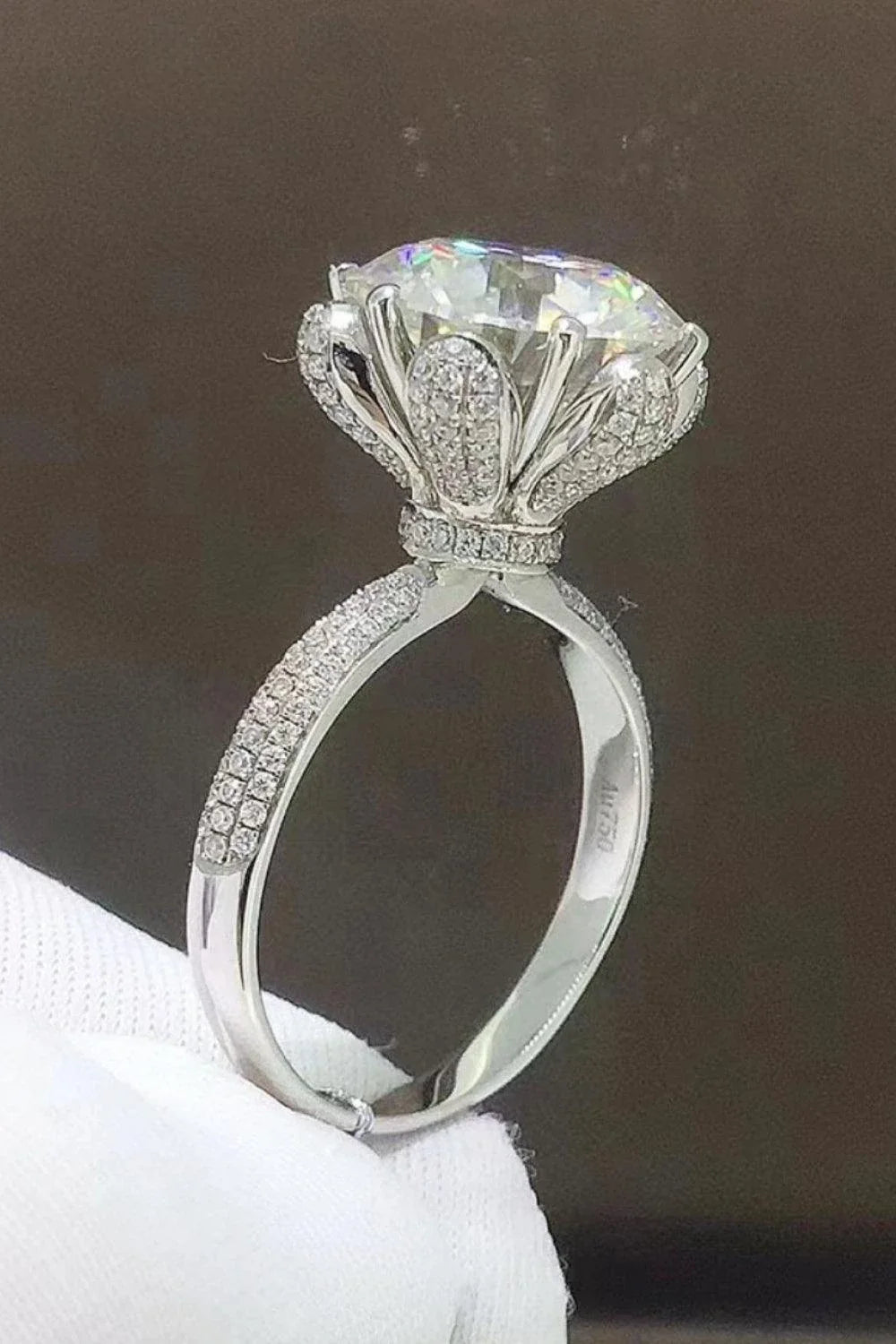 Exquisite 5-carat moissanite ring with zircon accents, crafted in 925 sterling silver with a sleek, modern design
