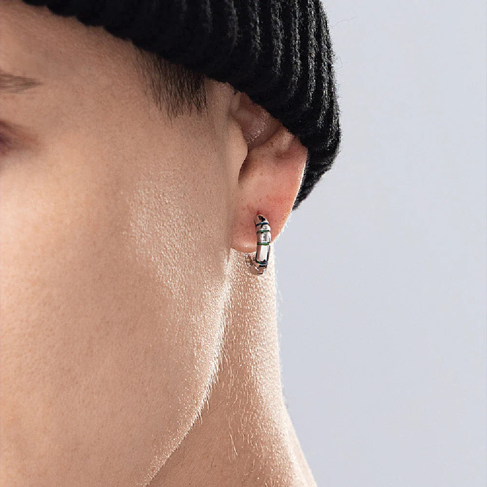 Sterling silver earrings with luminous accents, providing a soft, gentle glow for a touch of elegant sophistication.
