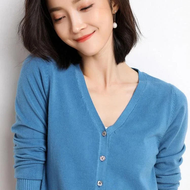 Chic v-neck single breasted cardigan in blue, green, and pink colours with a sophisticated and timeless design