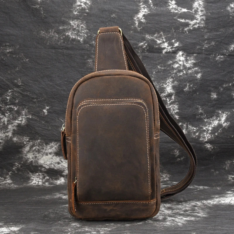 Vintage-inspired genuine leather briefcase with multiple compartments and secure zipper closure, ideal for modern commuters