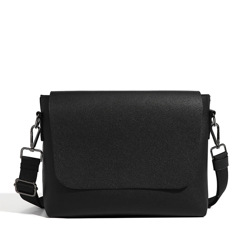 Black PU leather messenger bag with adjustable strap and zippered pockets, a stylish and practical accessory for British gentlemen