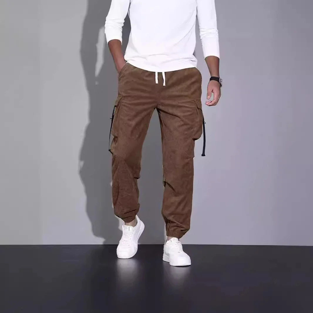 Premium British-inspired corduroy overalls with a relaxed, ankle-tied silhouette and stretchy, breathable fabric for all-day comfort and style.