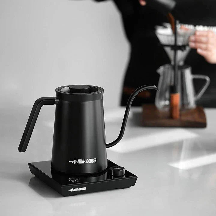 A stainless steel electric gooseneck kettle with precise temperature control and an elegant design, perfect for hand-brewing coffee at home.