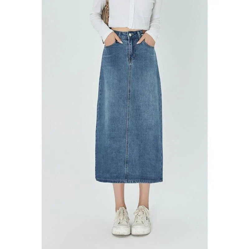 Classic blue A-line midi denim skirt with flattering empire waistline and flowy silhouette