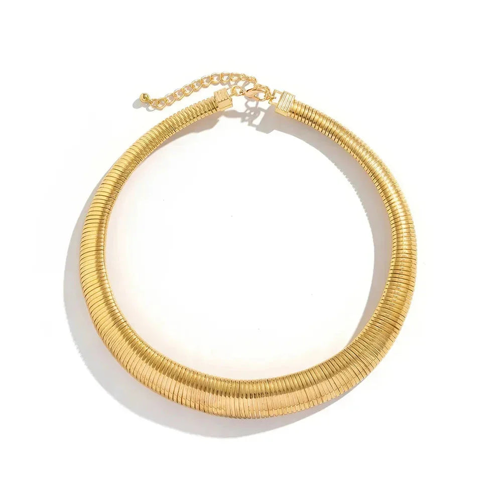 Captivating spiral chunky choker necklace in gold and silver colours, featuring a bold, geometric design for a unique, statement-making look.