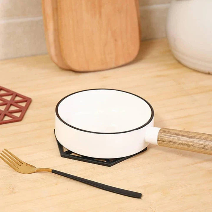 Geometric pattern cup coasters in a minimalist British design, made from durable rubber to protect surfaces