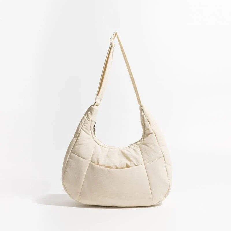 Chic Half Moon Puffer Shoulder Bag in a stylish pink colour, featuring a unique design and practical features for the modern woman.