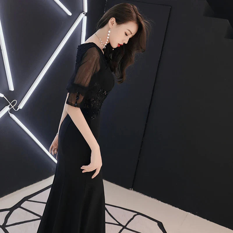 Elegant black evening dress with middle-length sleeves, perfect for formal occasions in the UK