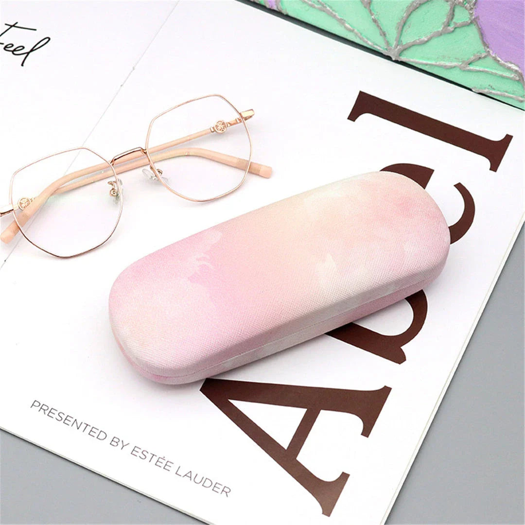 Gradient cloud printed eyewear case with metal frame and PU leather construction, protecting glasses from scratches and everyday wear and tear