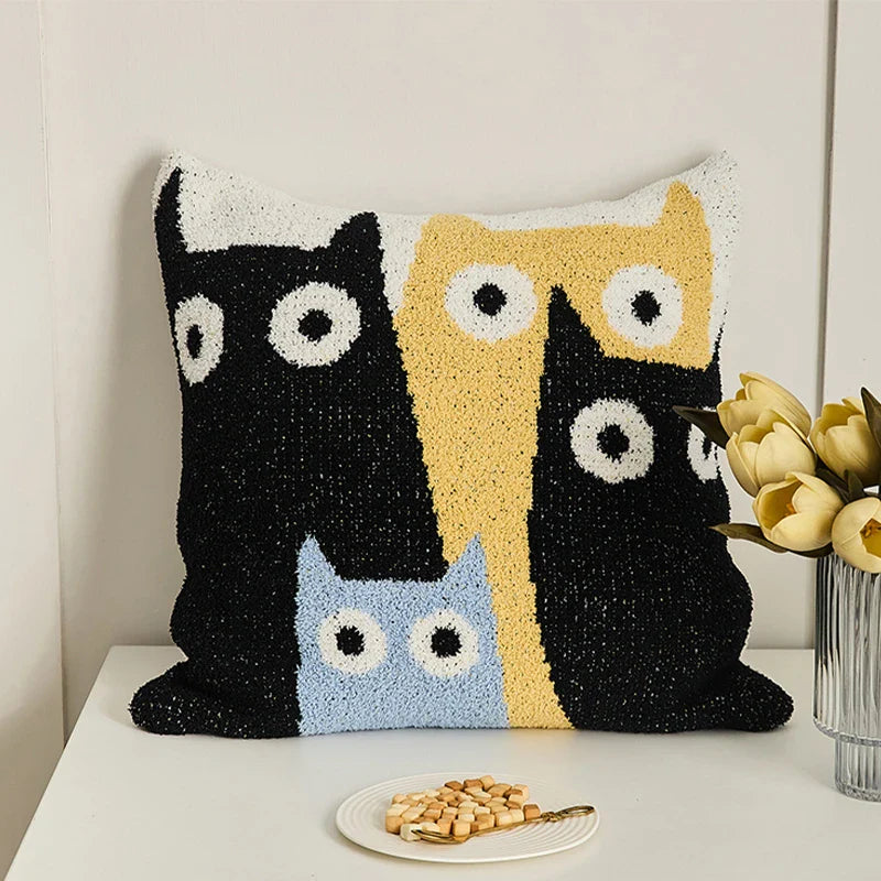 A cosy cushion cover with a charming crescent moon cat design, made from soft plush fabric for a luxurious home decor accent.