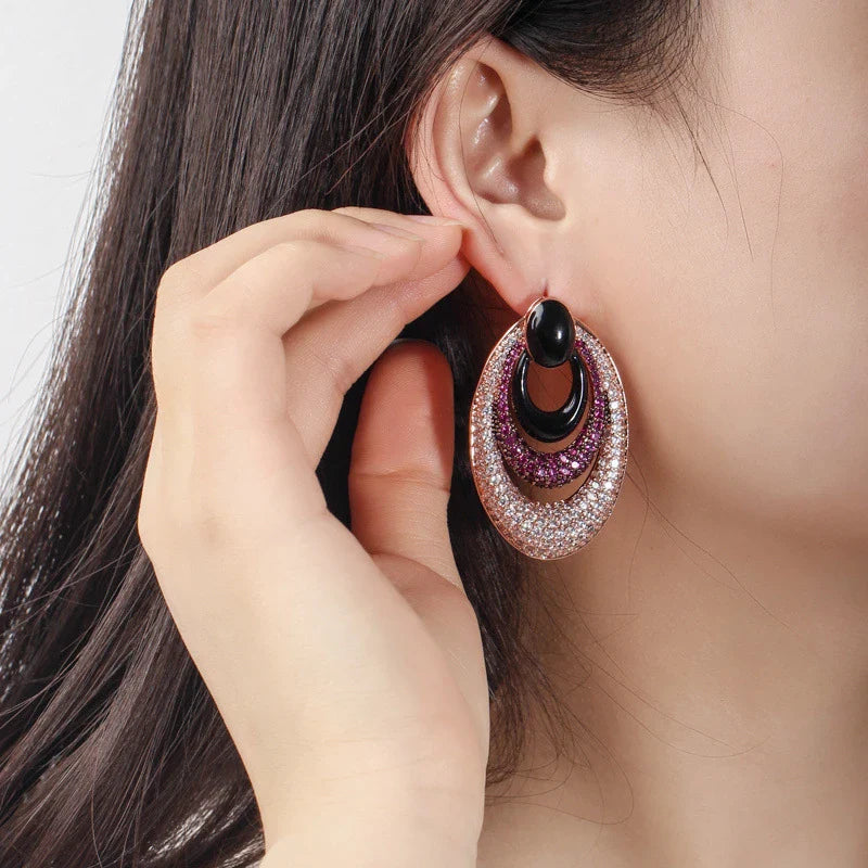 Elegant water drop-shaped ear studs in a vibrant red hue, adorned with a micro-inlaid zircon gemstone for a dazzling, sophisticated look.
