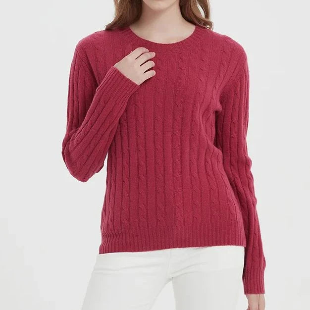 A luxurious 100% British wool cable knit jumper in a rich camel colour, perfect for keeping warm during the UK's chilly winters.