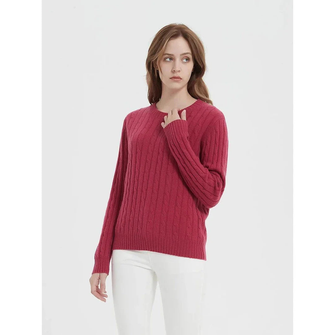 A luxurious 100% British wool cable knit jumper in a rich camel colour, perfect for keeping warm during the UK's chilly winters.