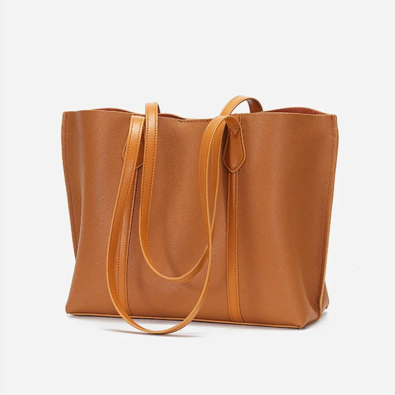 Premium cowhide leather shoulder bag with multiple compartments and adjustable strap for versatile everyday use