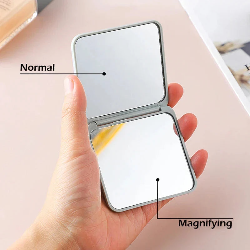 Portable Folding Double-Sided Makeup Mirror in Blue, Pink, Black, and Silver Colours