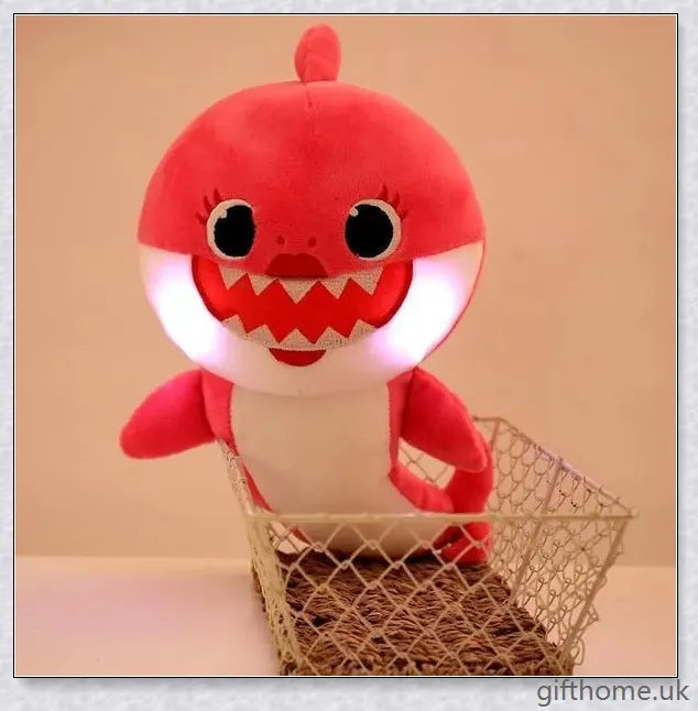 Soft and cuddly Baby Shark plush toy with captivating lights and music, perfect for young children's playtime
