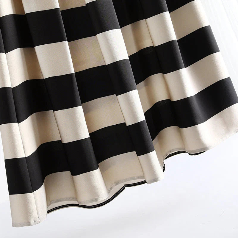 Elegant striped midi skirt with pleated design, made from premium polyester for a sophisticated and comfortable look.