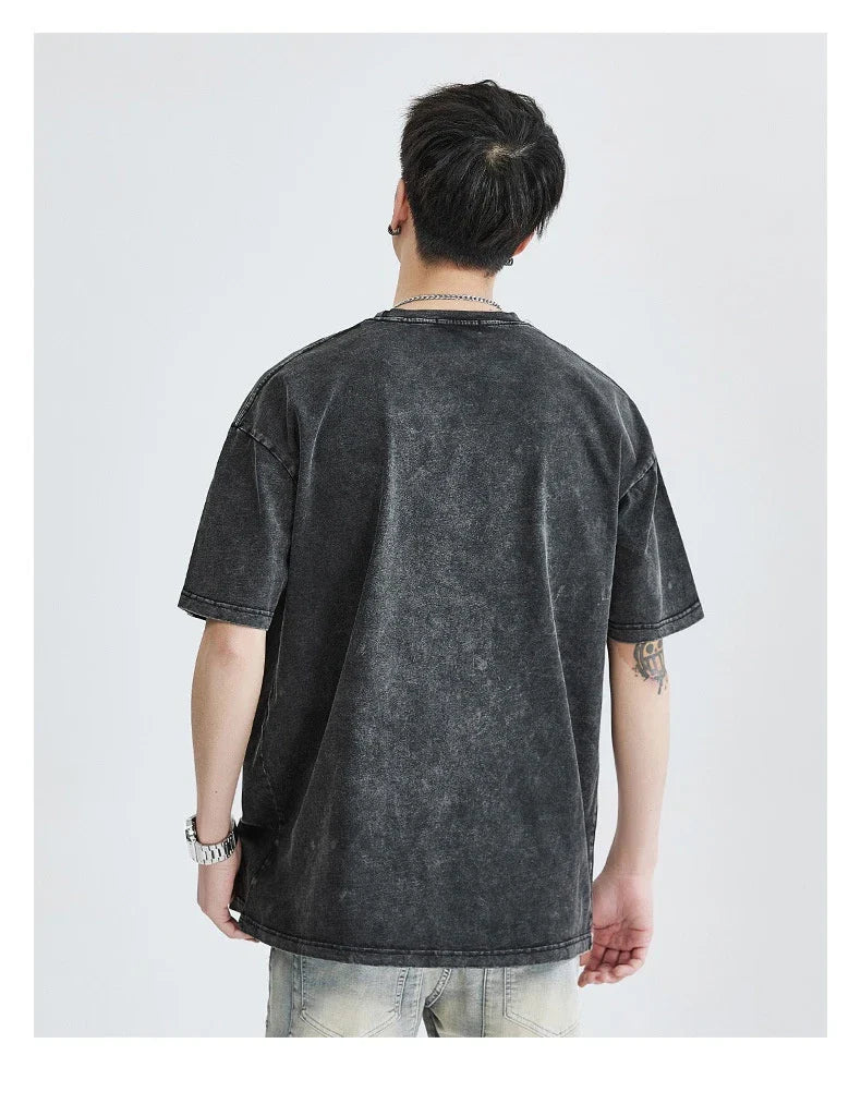 Premium vintage-inspired short-sleeved t-shirt in a distressed black colour, made of soft pure cotton fabric