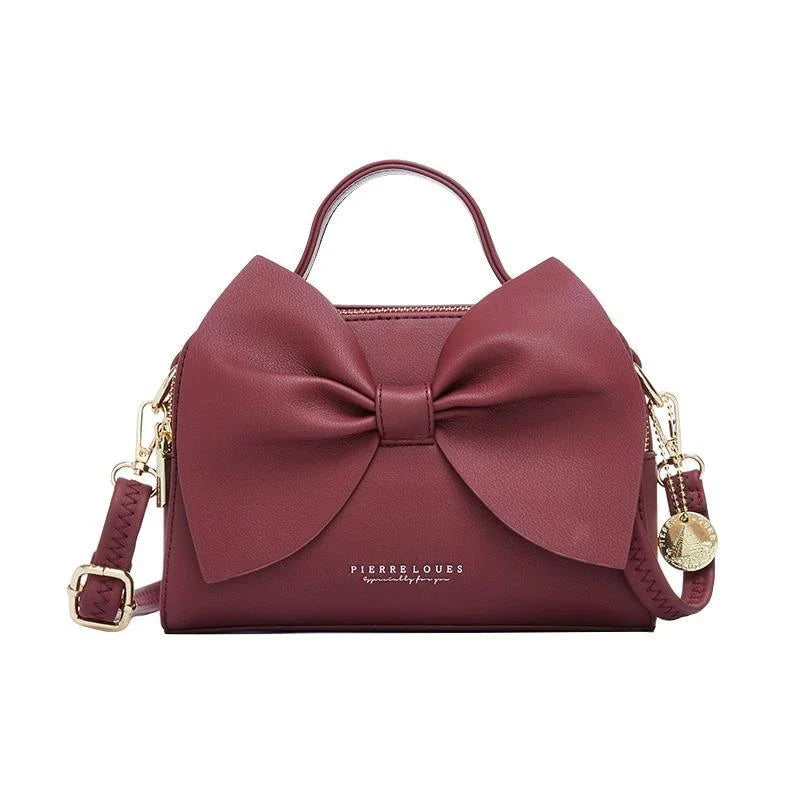 Elegant brown Korean-inspired bow shoulder bag with adjustable strap and roomy interior