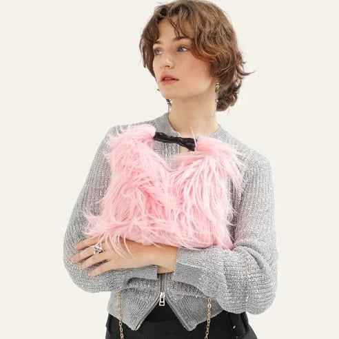 Soft, plush lime-coloured faux fur bucket bag with adjustable strap and chic chain decoration