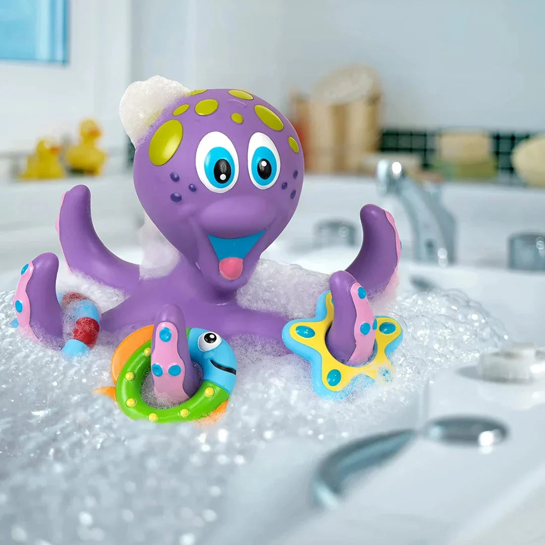 A purple octopus bath toy with colourful rings for tossing and splashing in the water