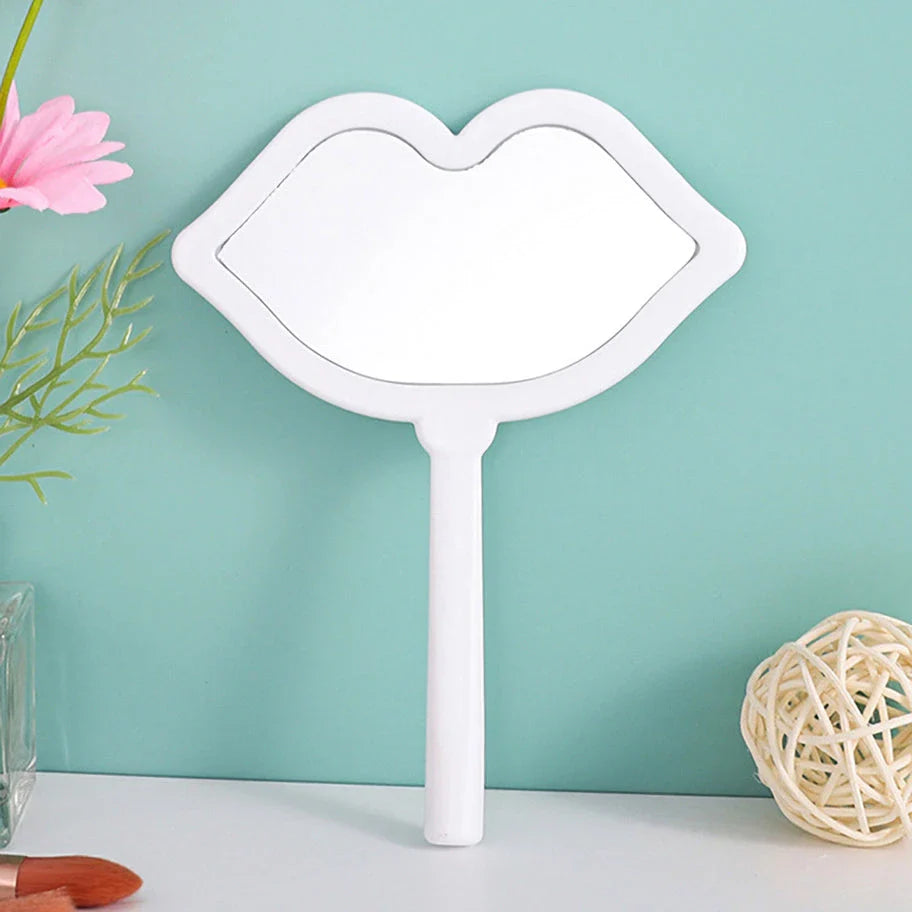 Lip-shaped handheld makeup mirror with a comfortable ergonomic handle for precise on-the-go touch-ups