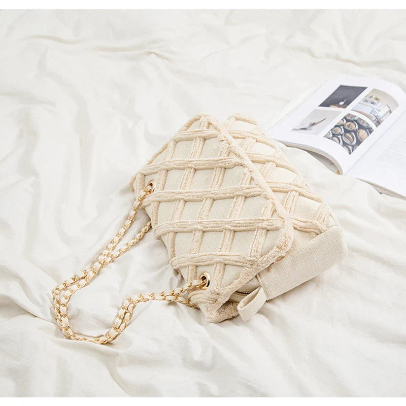 A stylish, retro-inspired shoulder bag with a minimalist rhombus pattern design, perfect for the modern, fashion-conscious woman in the UK.