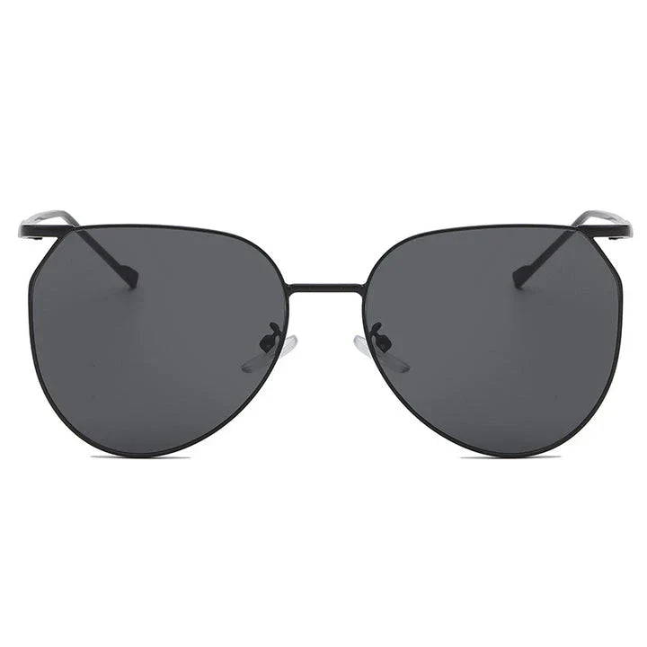 Elegant oval-shaped sunglasses with gradient lenses and alloy frames, offering timeless British style and UV protection.