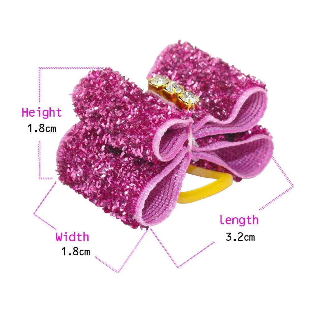 Glittery hair bows for dogs in various quantities, made with premium nylon for long-lasting durability and a sparkling finish.