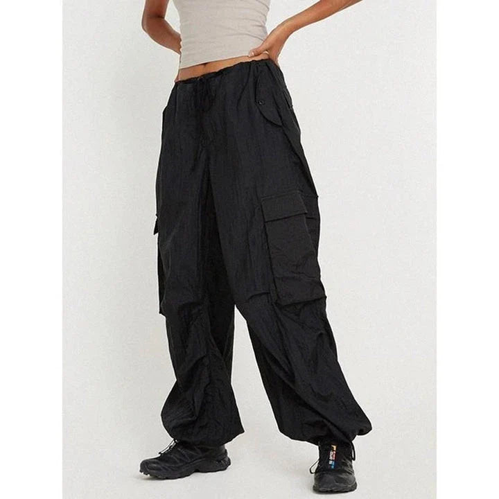 Stylish high-waist safari-inspired cargo trousers for women in black, featuring a comfortable, flattering fit and practical pockets.