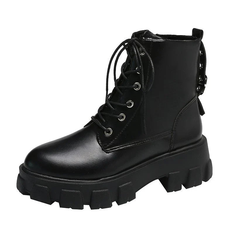Stylish women's leather boots with a handsome locomotive design, durable rubber soles, and a comfortable round toe for autumn and winter wear.