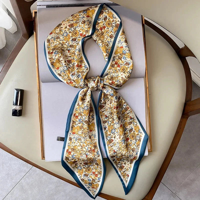 Elegant floral print polyester scarf with a soft, cotton-like texture for versatile seasonal wear