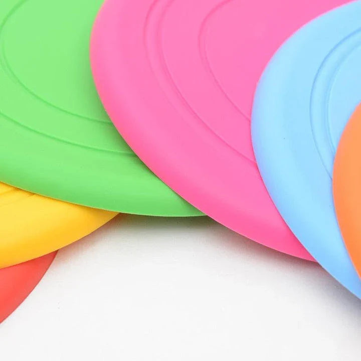 Colourful silicone frisbee dog toy with flexible, durable construction for energetic playtime