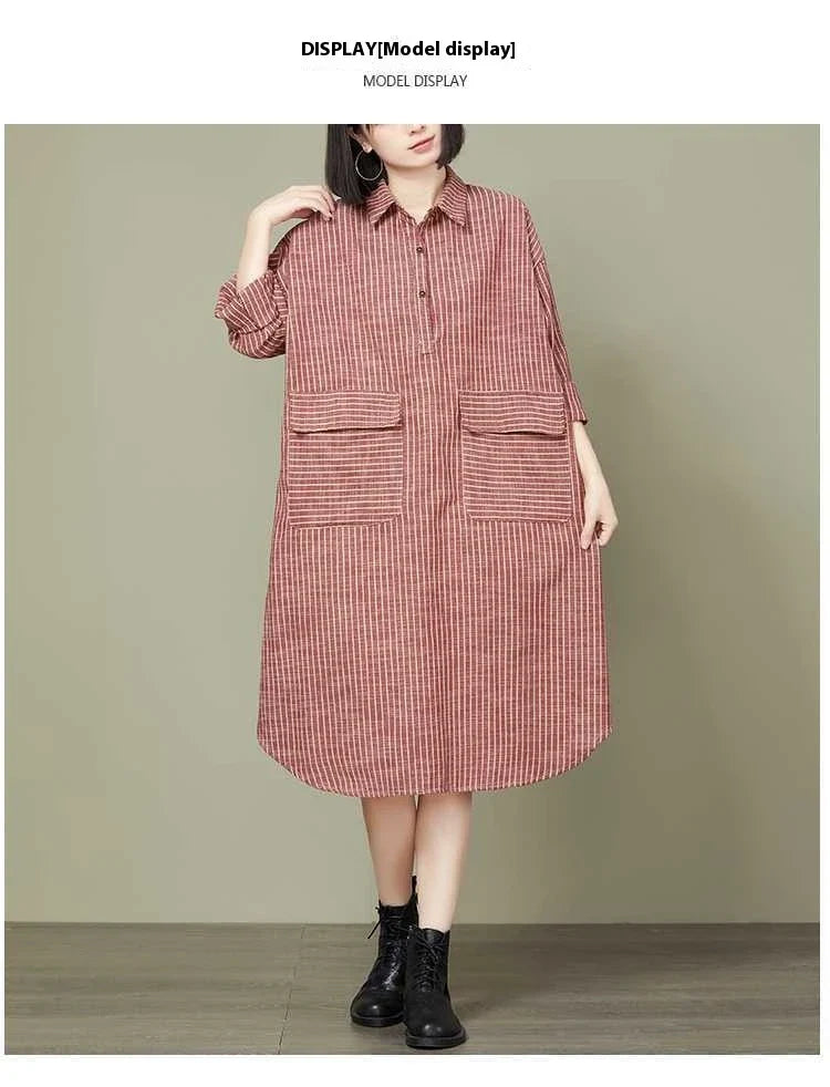 Plus-size women's dress with a striped pattern, asymmetric skirt, and long loose sleeves