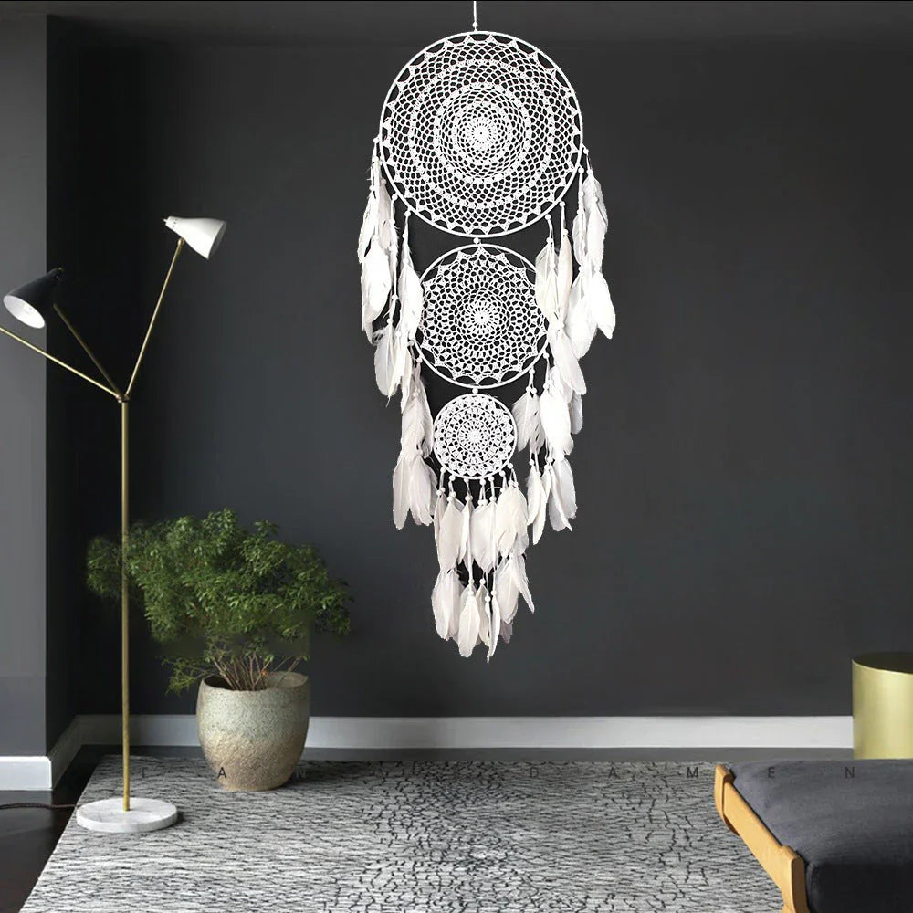 Colourful three-ring dreamcatcher wall hanging with feathers and beads, a unique and eye-catching home decor accent
