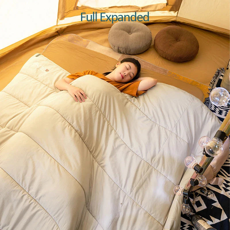 Premium 3-season sleeping bag with spacious design, warm yet breathable fabric, and removable liner for easy cleaning
