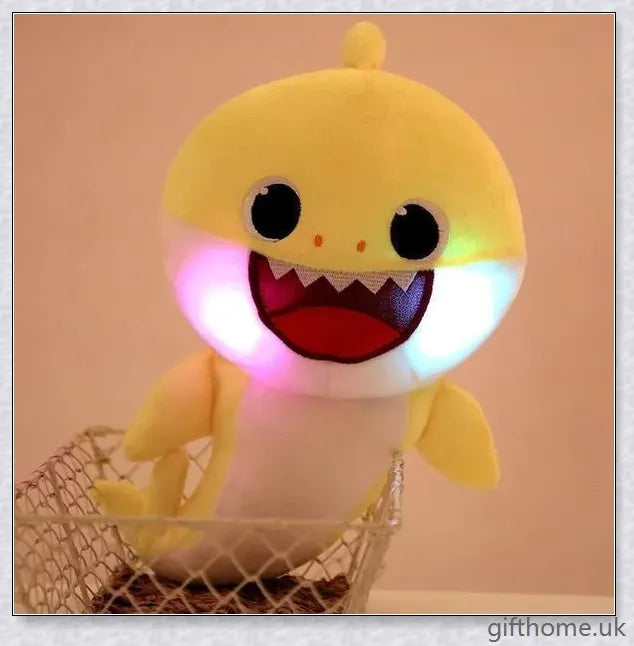 Soft and cuddly Baby Shark plush toy with captivating lights and music, perfect for young children's playtime