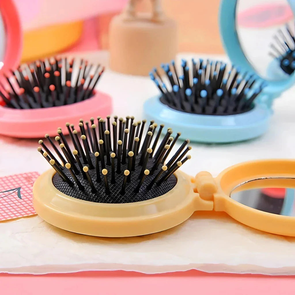 Compact folding hair comb with mirror, perfect for on-the-go touch-ups and styling for British customers
